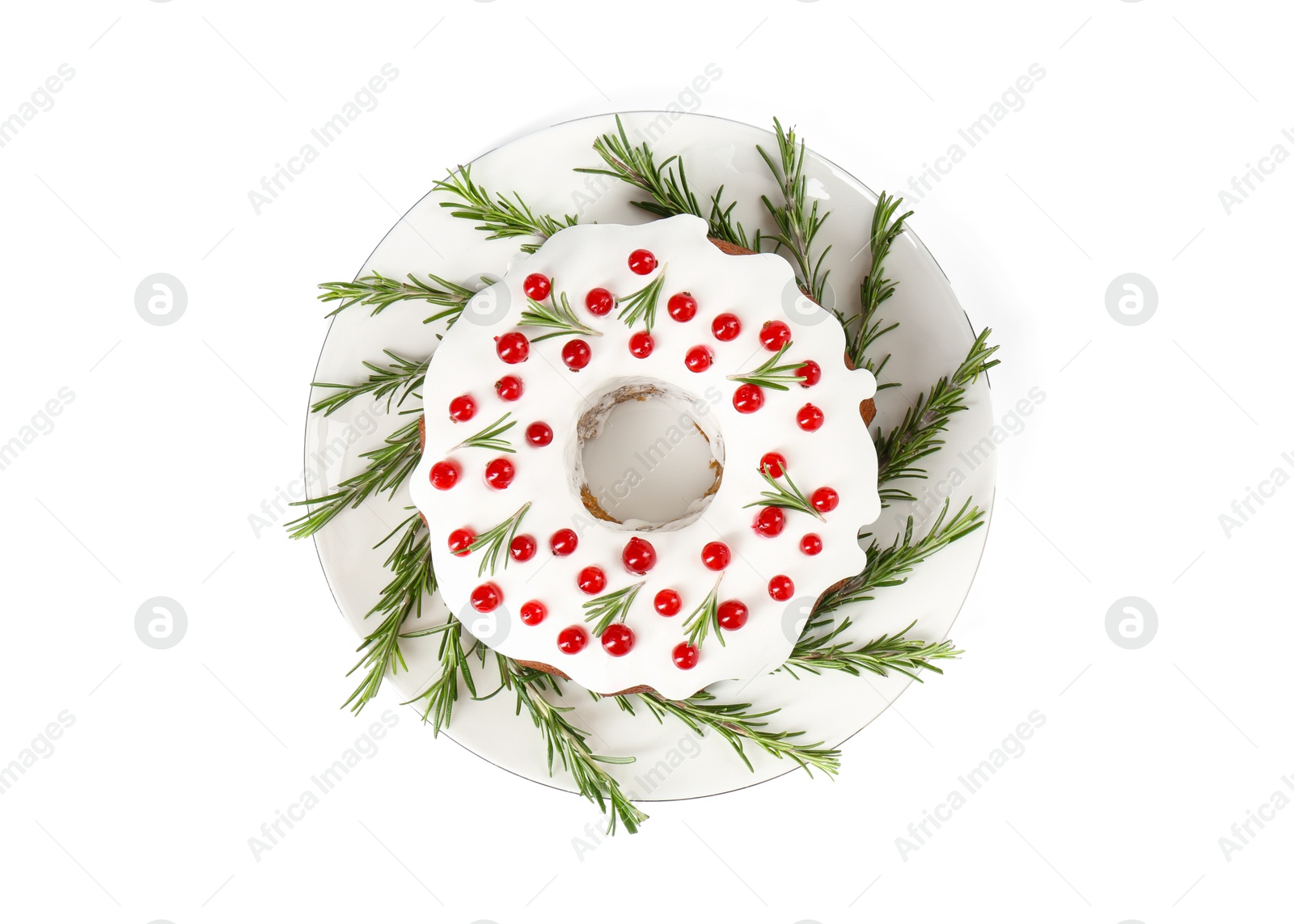 Photo of Traditional Christmas cake decorated with currants and rosemary isolated on white, top view