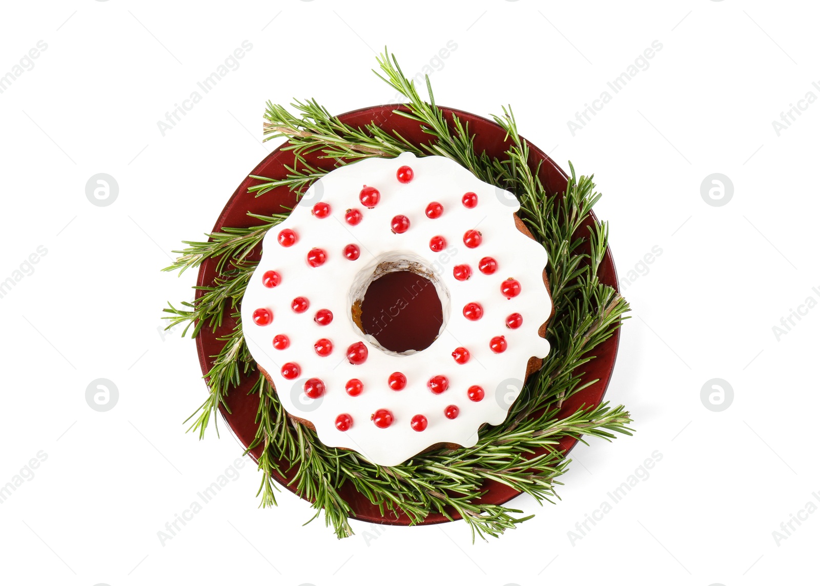 Photo of Traditional Christmas cake decorated with currants and rosemary isolated on white, top view