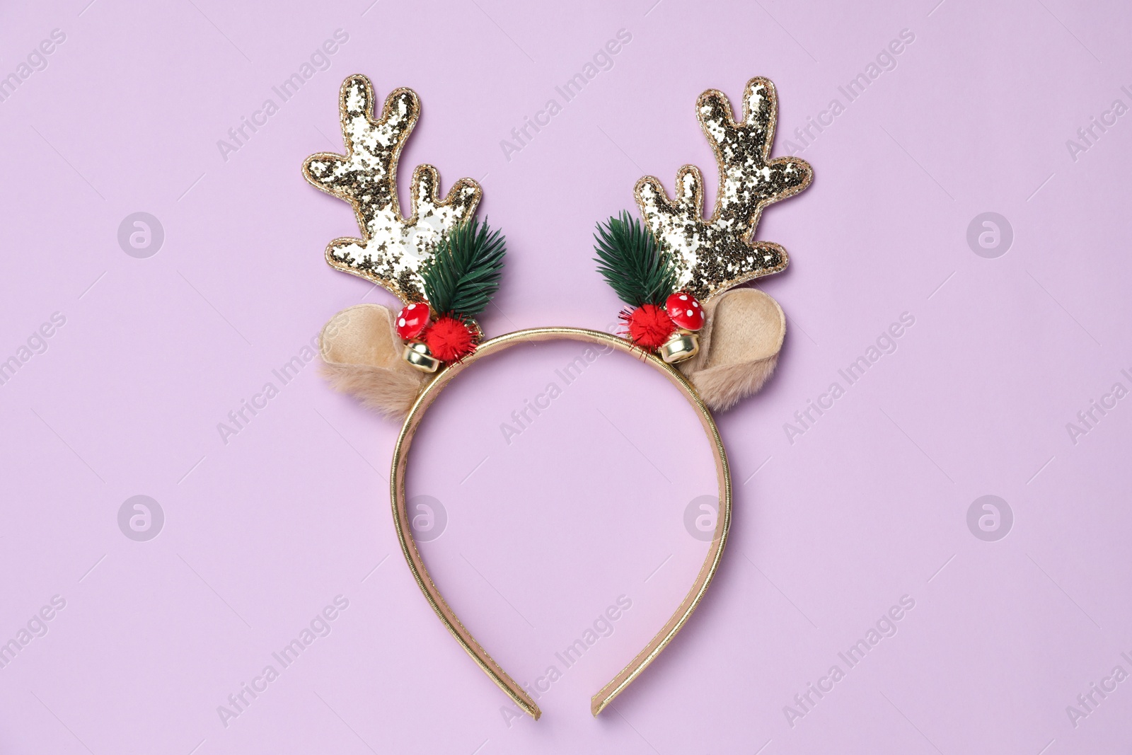 Photo of Beautiful reindeer headband on lilac background, top view. Christmas accessory