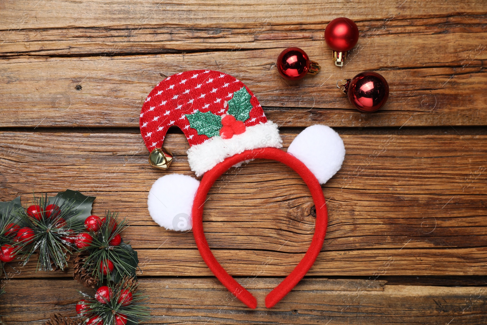 Photo of Stylish party headband and Christmas decor on wooden background, flat lay