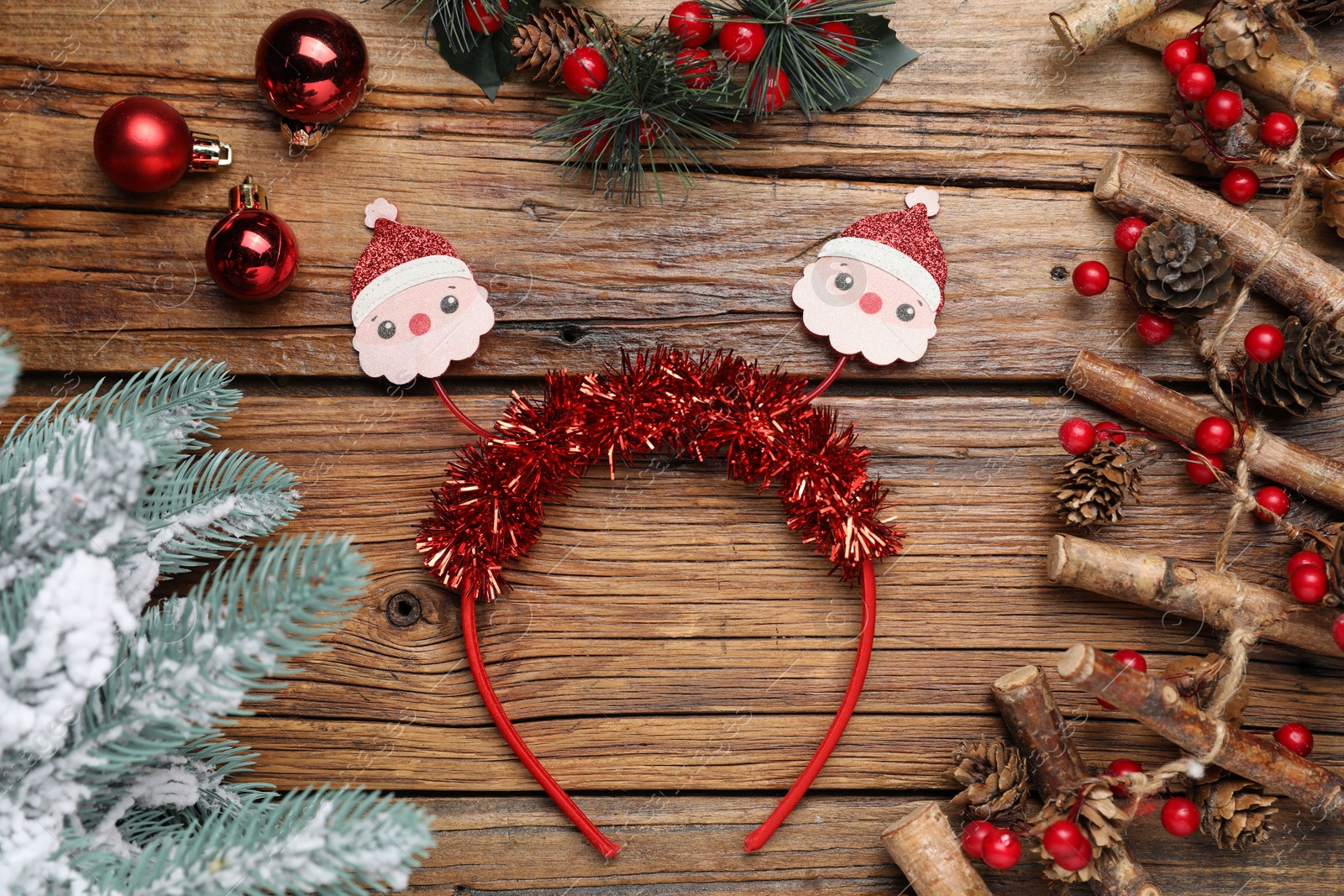 Photo of Stylish party headband and Christmas decor on wooden background, flat lay