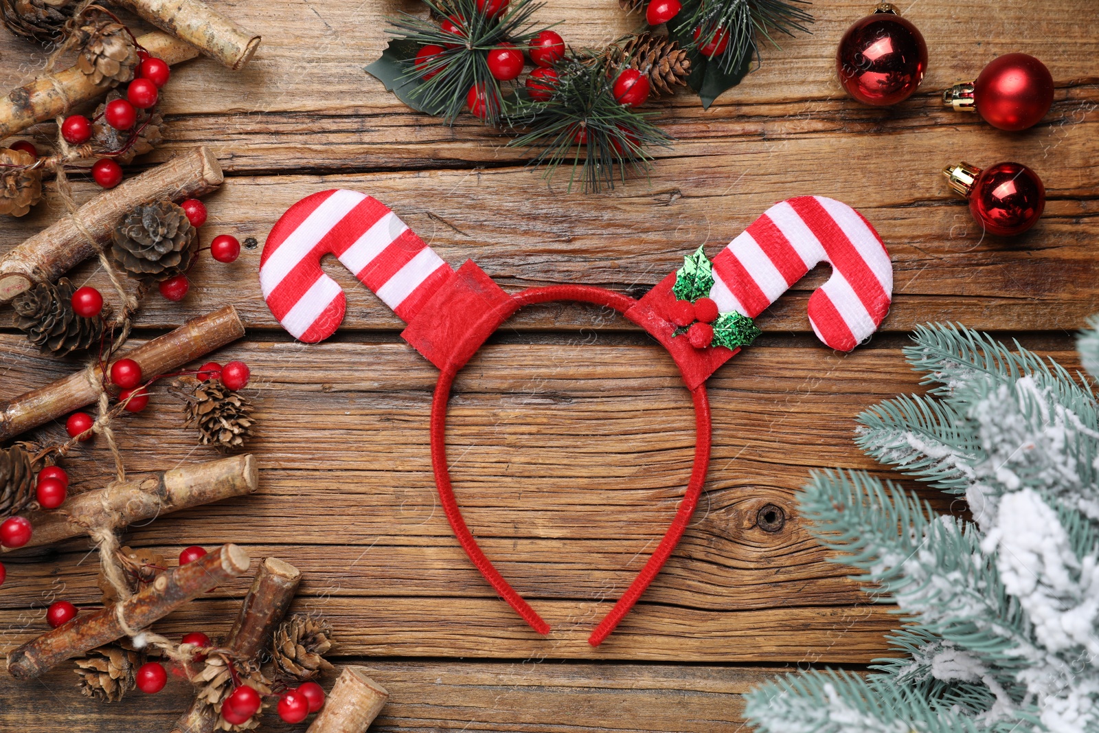 Photo of Stylish party headband and Christmas decor on wooden background, flat lay