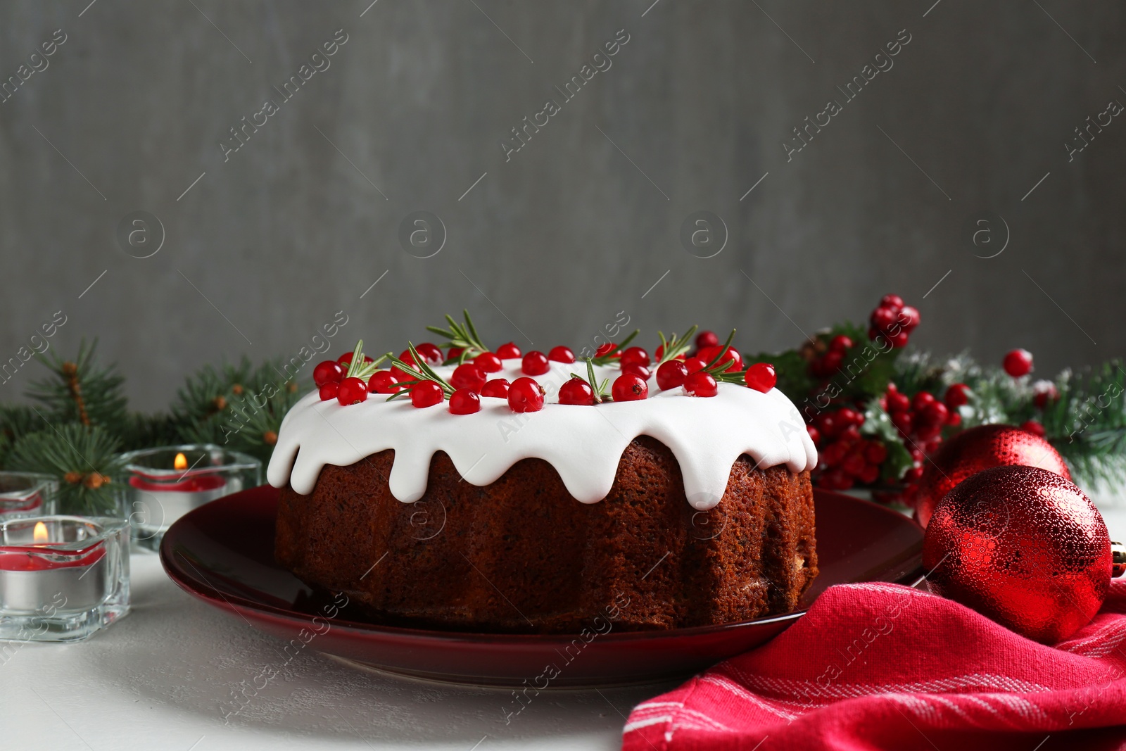 Photo of Traditional classic Christmas cake and decor on white table