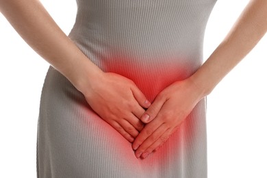 Image of STD (sexually transmitted diseases). Woman holding hands near her groin on white background, closeup