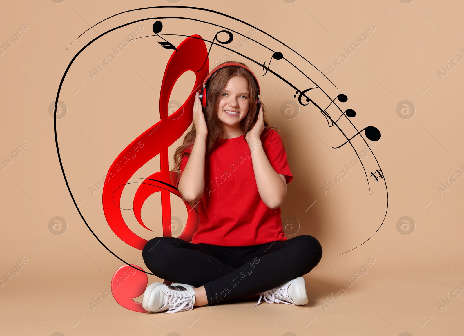 Image of Smiling teenage girl with headphones on beige background. Music notes flying near her