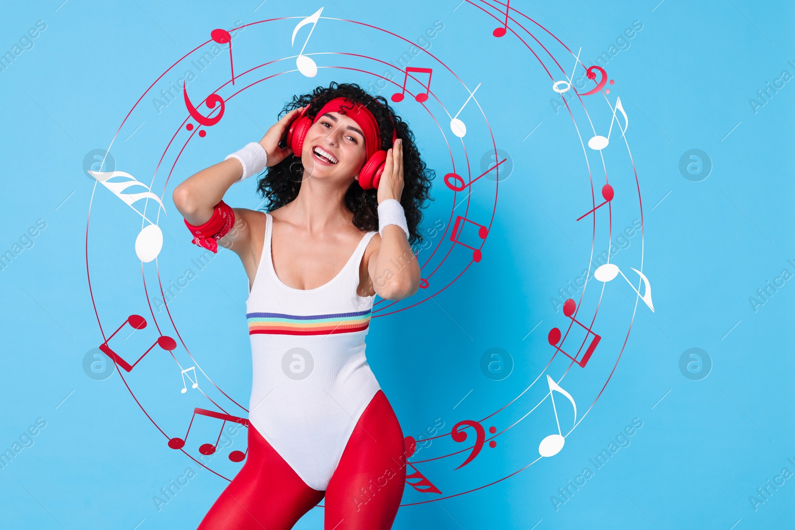 Image of Happy woman with headphones on light blue background. Music notes flying near her