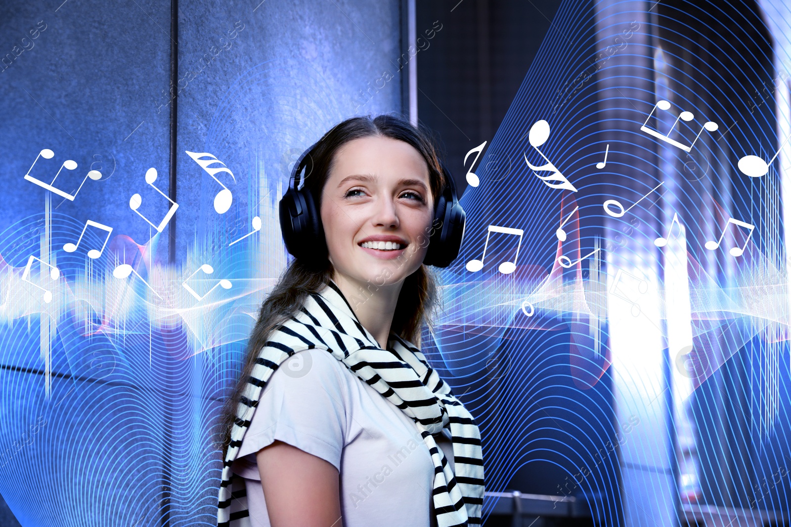 Image of Smiling woman with headphones outdoors. Music notes and sound waves flying near her