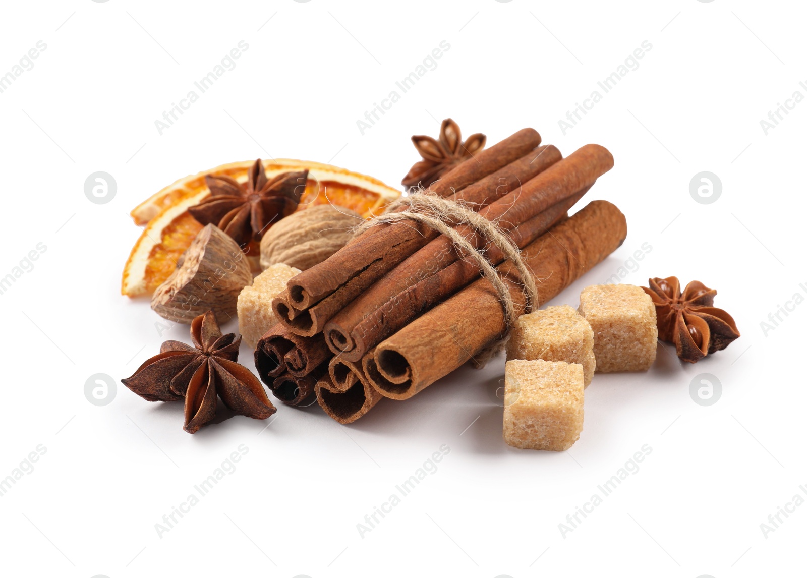 Photo of Different aromatic spices isolated on white. Christmas season