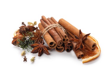 Photo of Different aromatic spices isolated on white. Christmas season