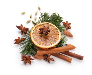 Photo of Different aromatic spices isolated on white. Christmas season