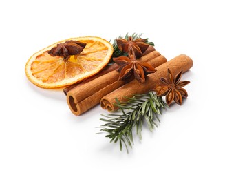 Photo of Different aromatic spices isolated on white. Christmas season