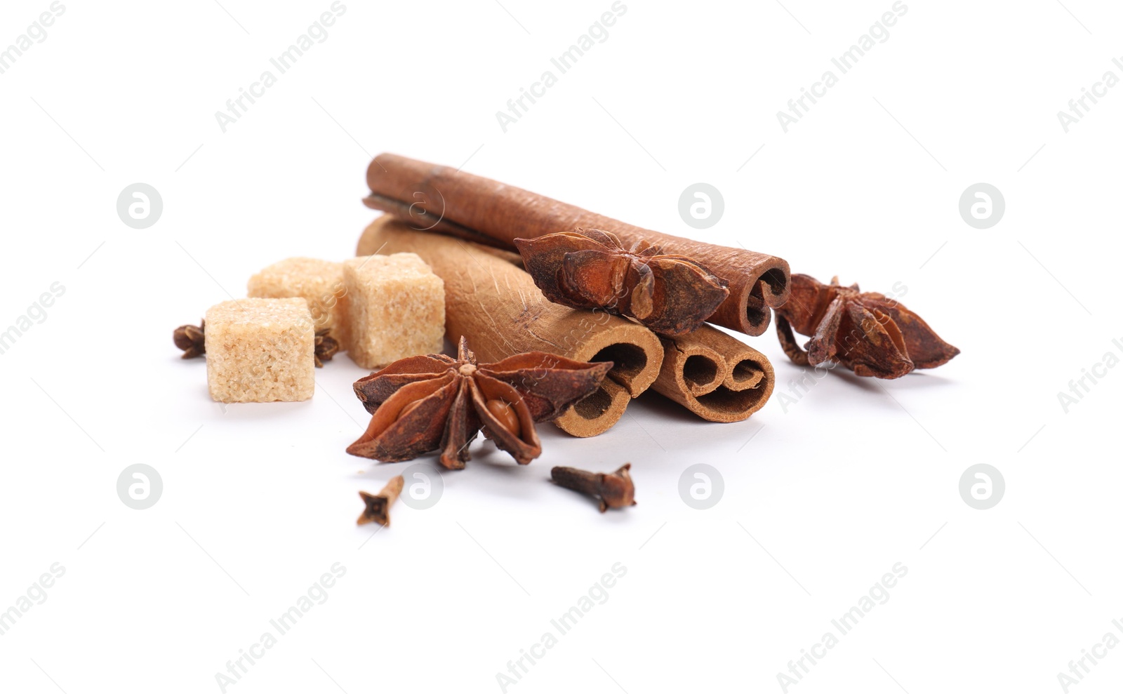 Photo of Different aromatic spices isolated on white. Christmas season