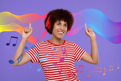 Image of Happy young woman with headphones dancing on violet background. Music notes and sound waves flying near her