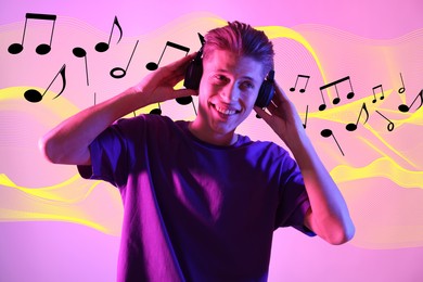 Young man with headphones on pink background in neon lights. Music notes and sound waves flying near him