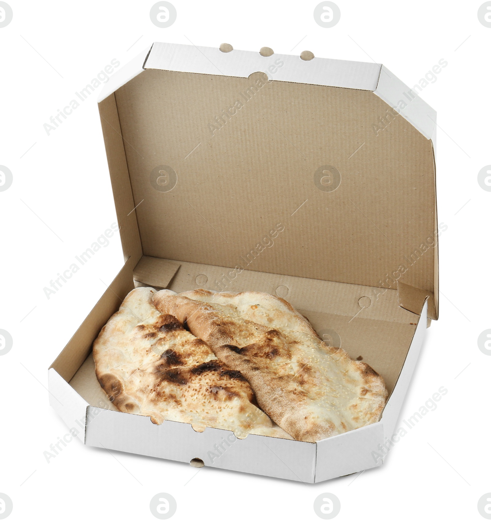 Photo of Delicious calzones in cardboard box isolated on white