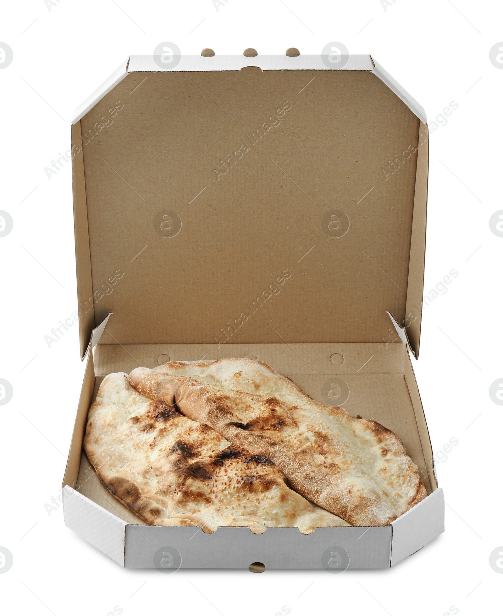 Photo of Delicious calzones in cardboard box isolated on white