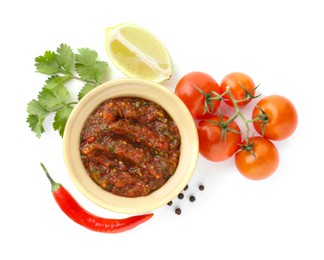 Photo of Tasty salsa sauce and ingredients isolated on white, top view