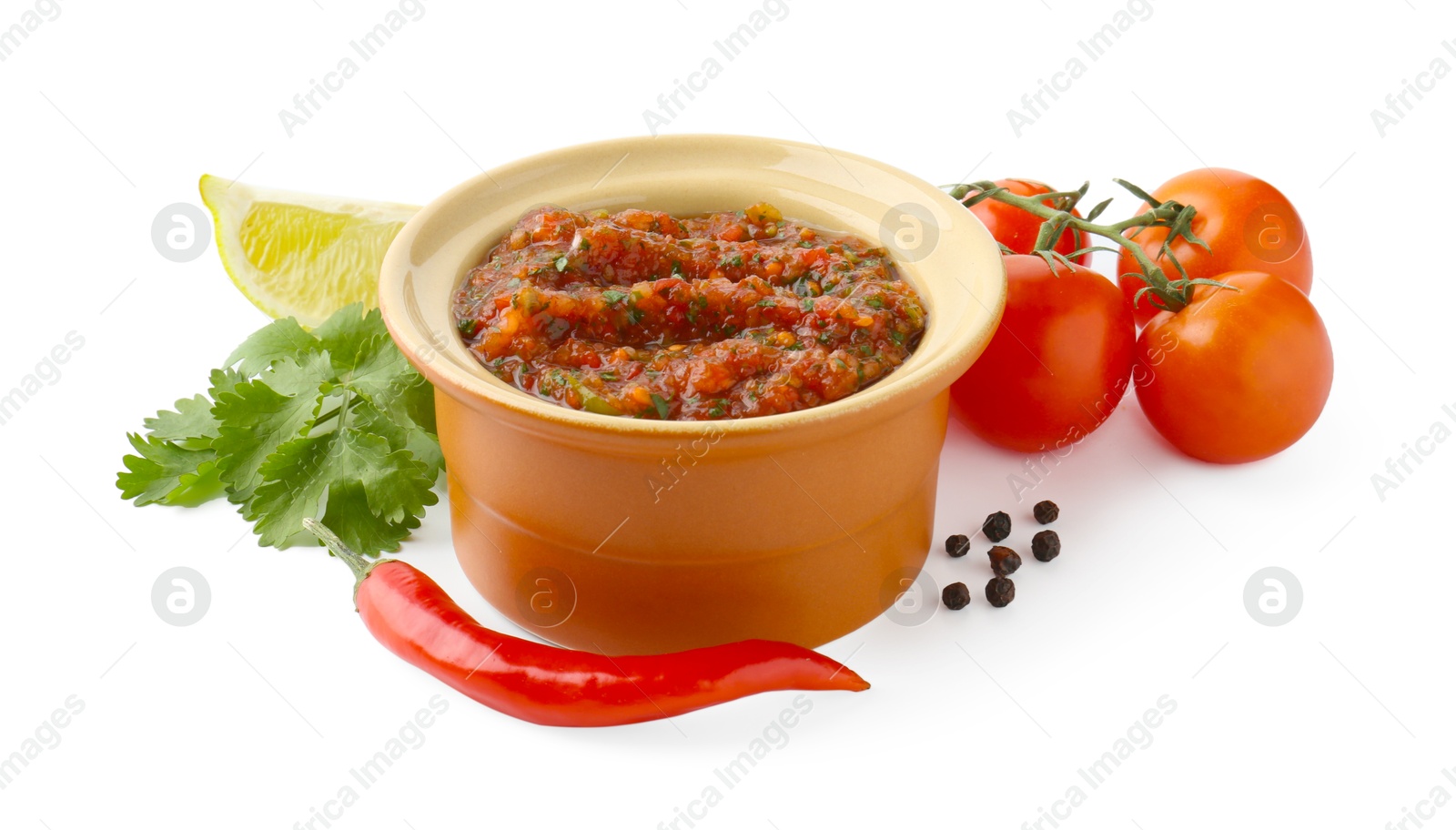 Photo of Tasty salsa sauce and ingredients isolated on white