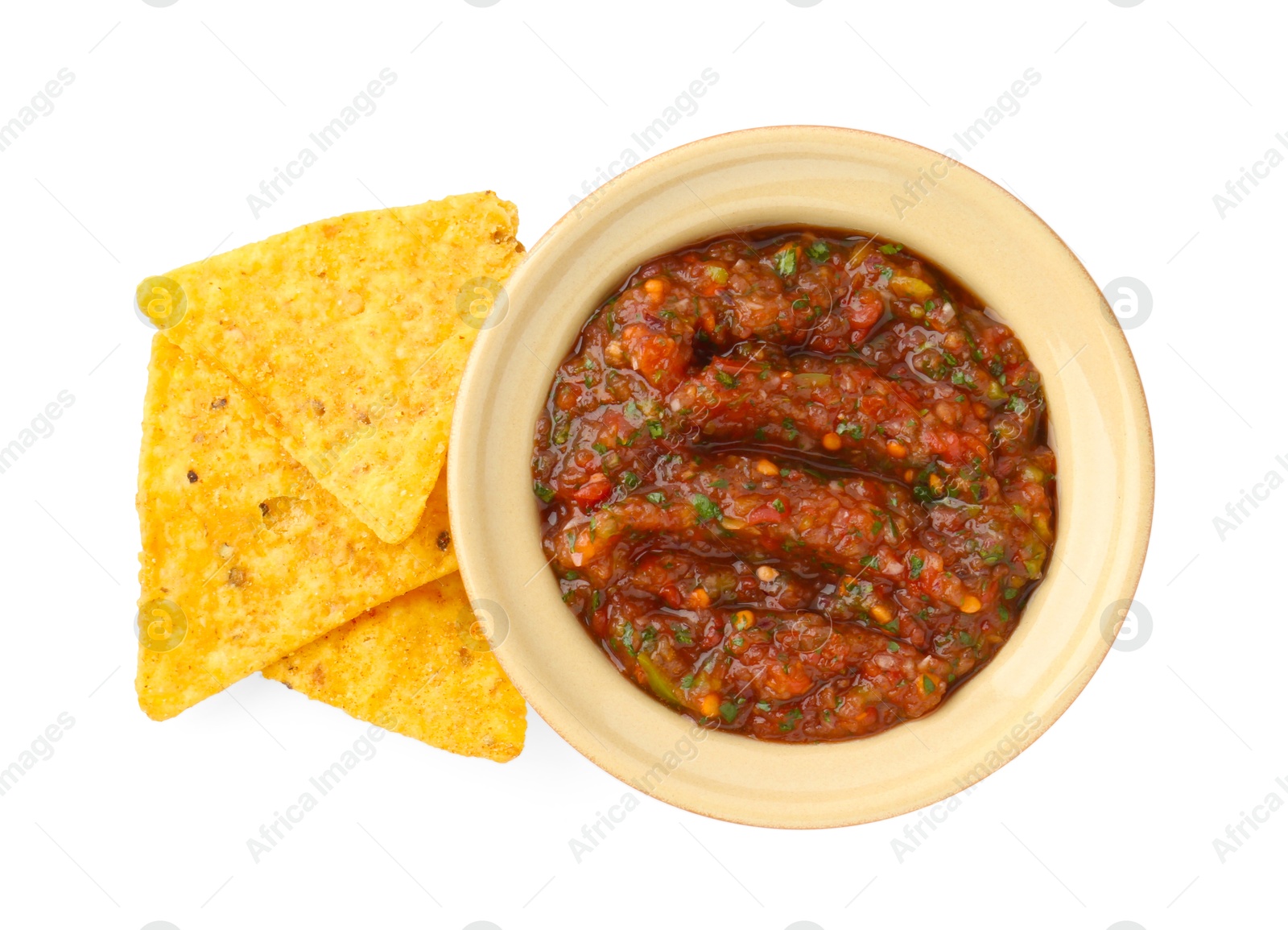 Photo of Tasty salsa sauce in bowl and tortilla chips isolated on white, top view