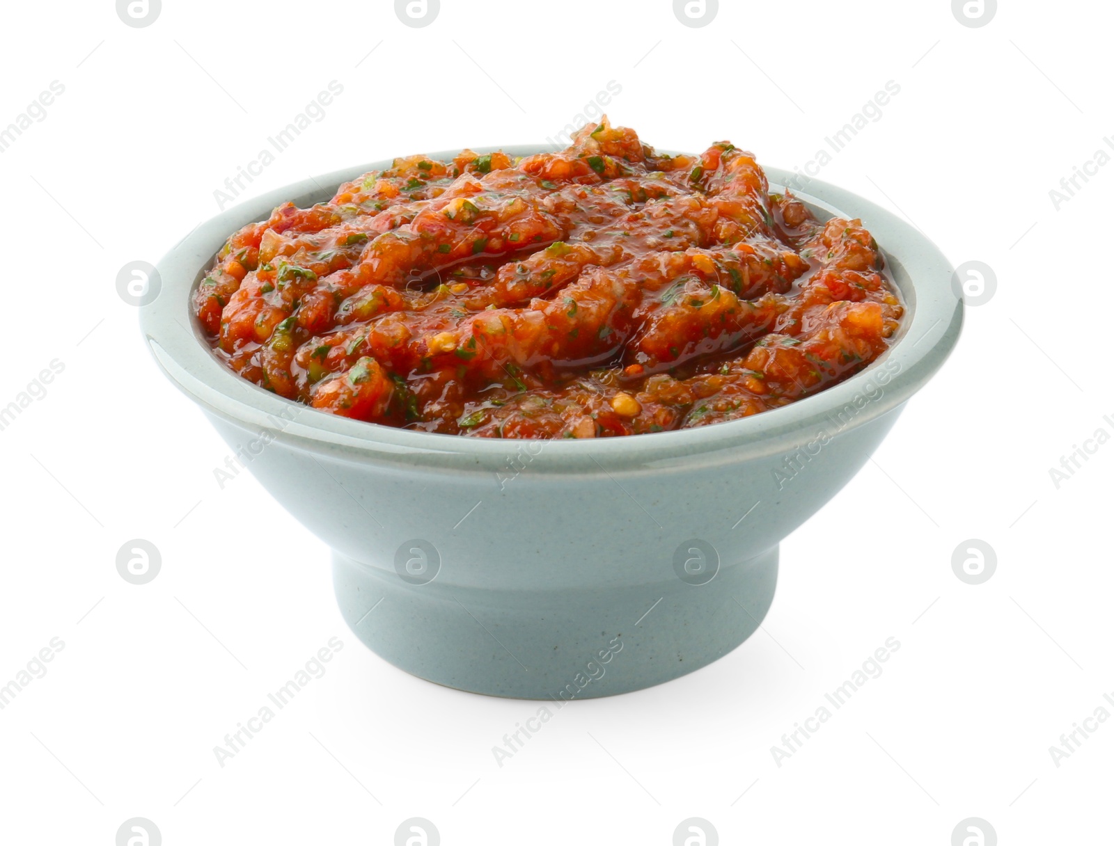 Photo of Tasty salsa sauce in bowl isolated on white