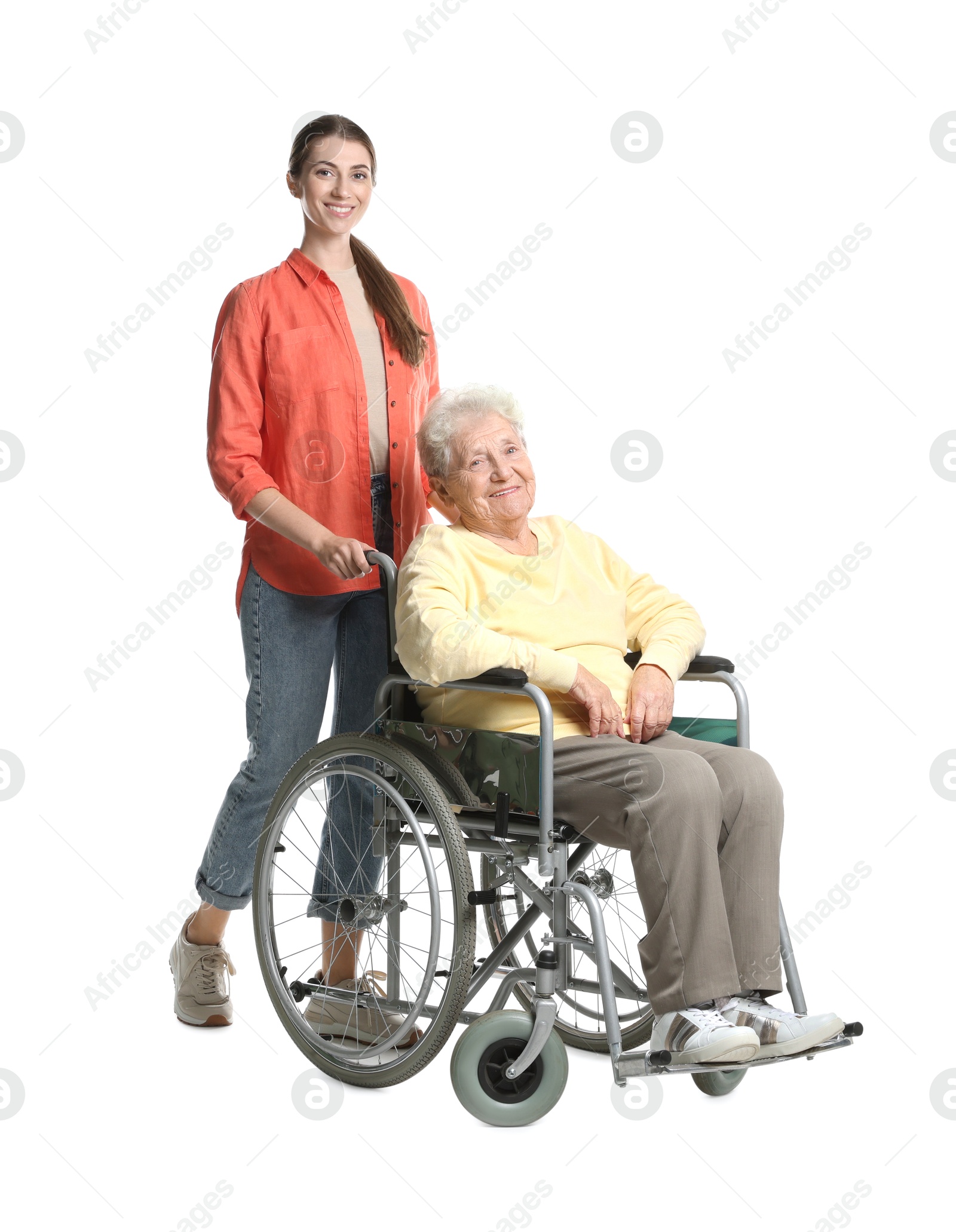 Photo of Caregiver with elderly woman in wheelchair on white background