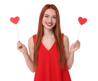 Photo of Young woman in red dress with paper hearts on white background