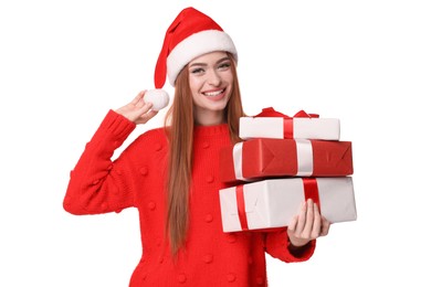 Photo of Young woman in red sweater and Santa hat with Christmas gifts on white background