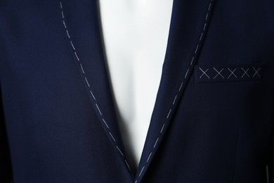 Photo of Blue semi-ready jacket on mannequin, closeup view