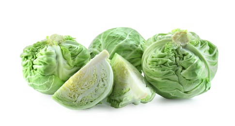 Photo of Whole and cut cabbages isolated on white