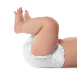 Photo of Little baby in diaper on white background, closeup