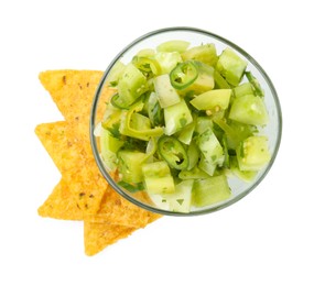 Photo of Delicious homemade green salsa with nachos isolated on white, top view