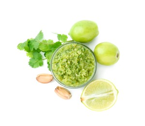 Photo of Delicious homemade green salsa and ingredients isolated on white, top view