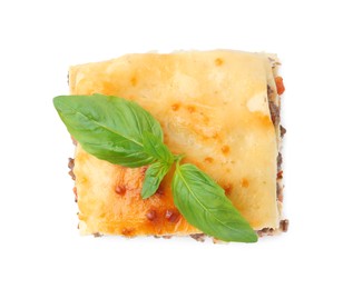 Photo of Delicious cooked lasagna with basil isolated on white, top view