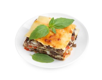 Photo of Delicious cooked lasagna with basil isolated on white