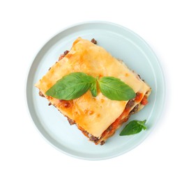 Photo of Delicious cooked lasagna with basil isolated on white, top view