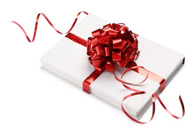 Photo of One book with red bow as gift isolated on white