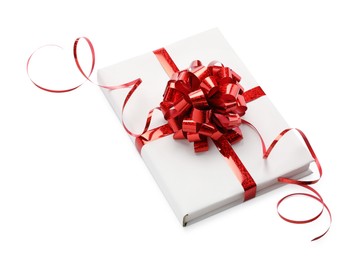 Photo of One book with red bow as gift isolated on white