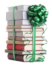 Photo of Stack of books with green bow as gift isolated on white