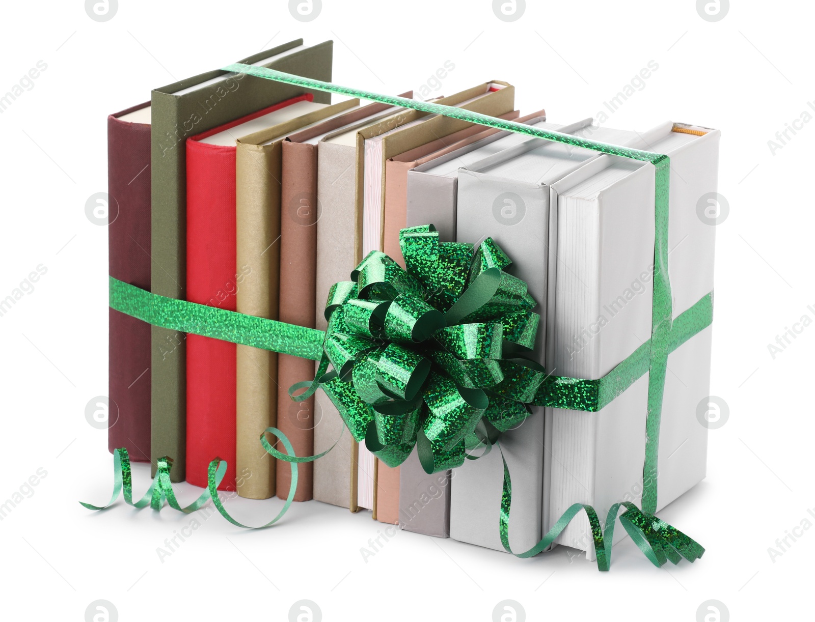 Photo of Many books with green bow as gift isolated on white