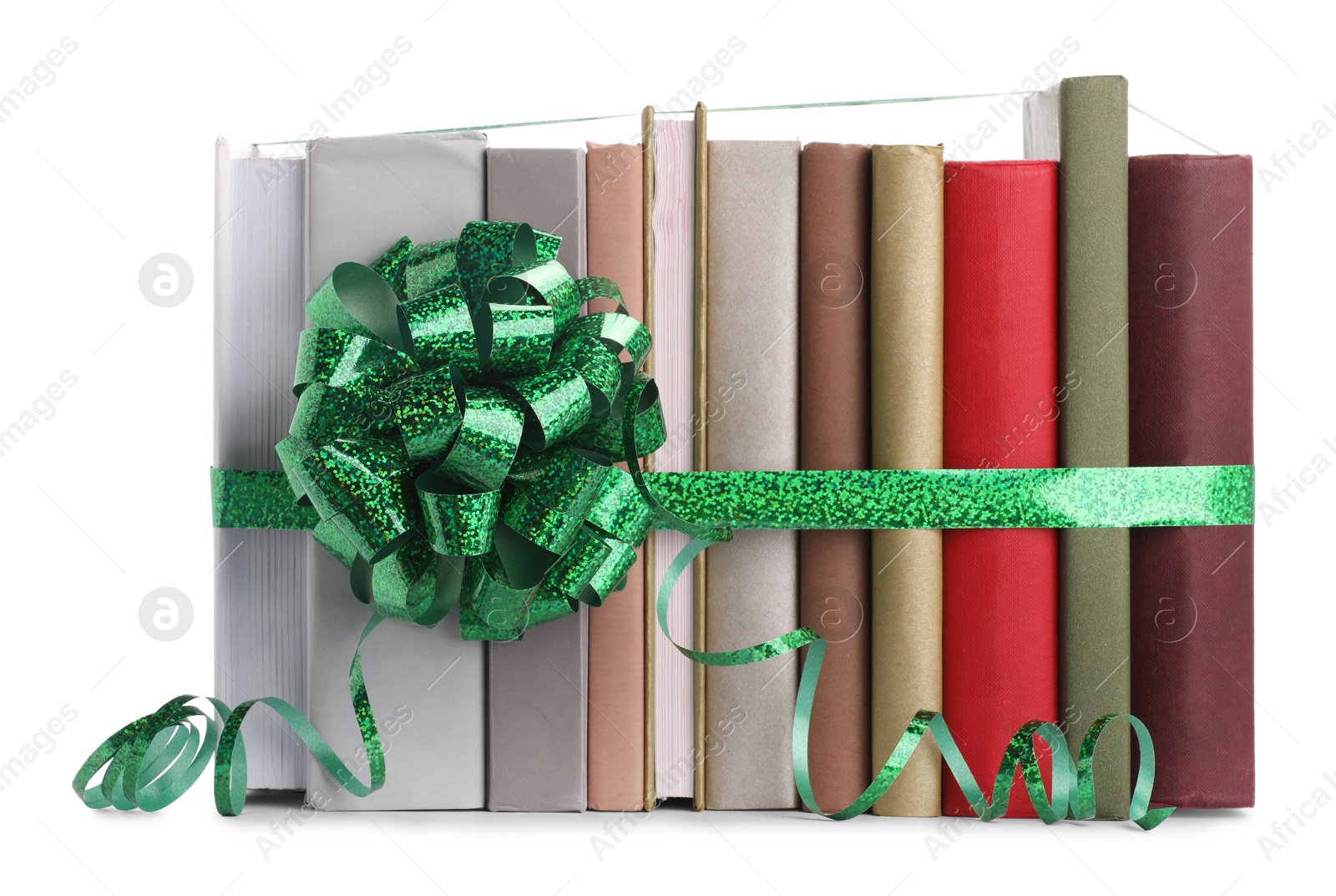 Photo of Many books with green bow as gift isolated on white