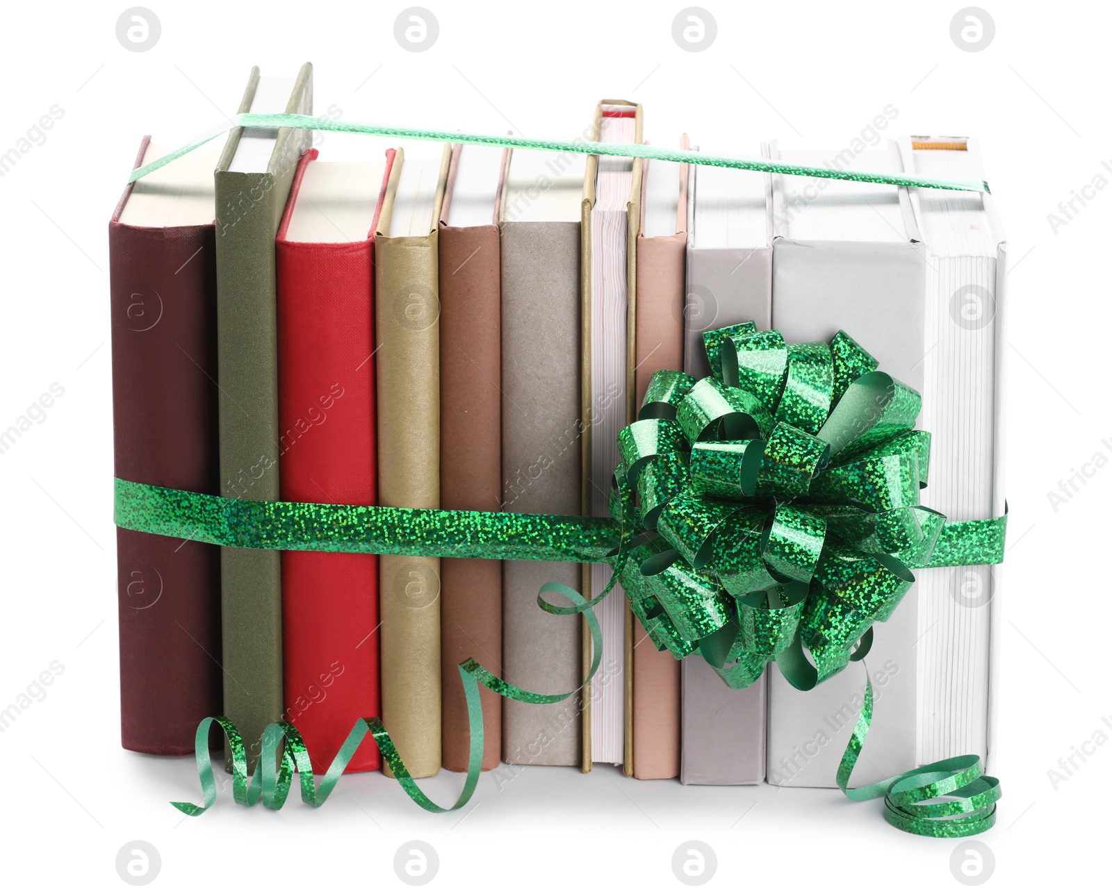 Photo of Many books with green bow as gift isolated on white