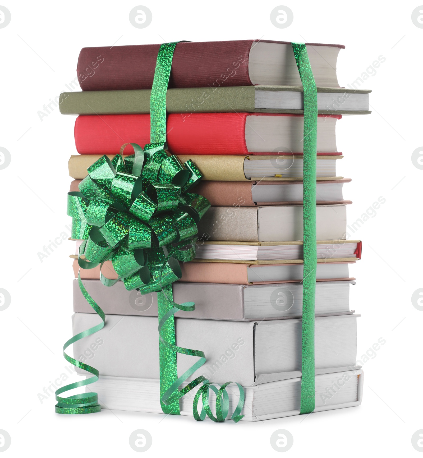 Photo of Stack of books with green bow as gift isolated on white