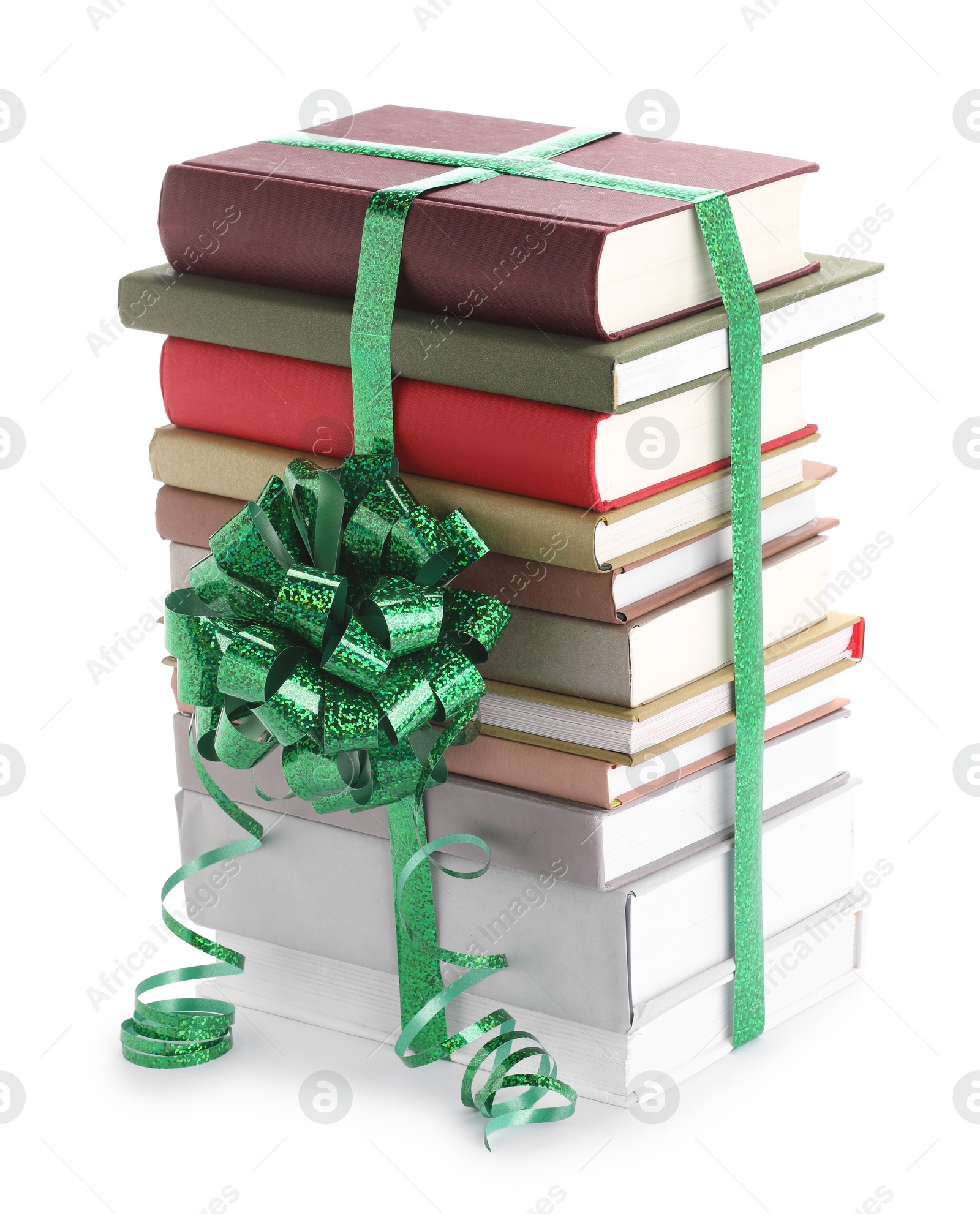 Photo of Stack of books with green bow as gift isolated on white