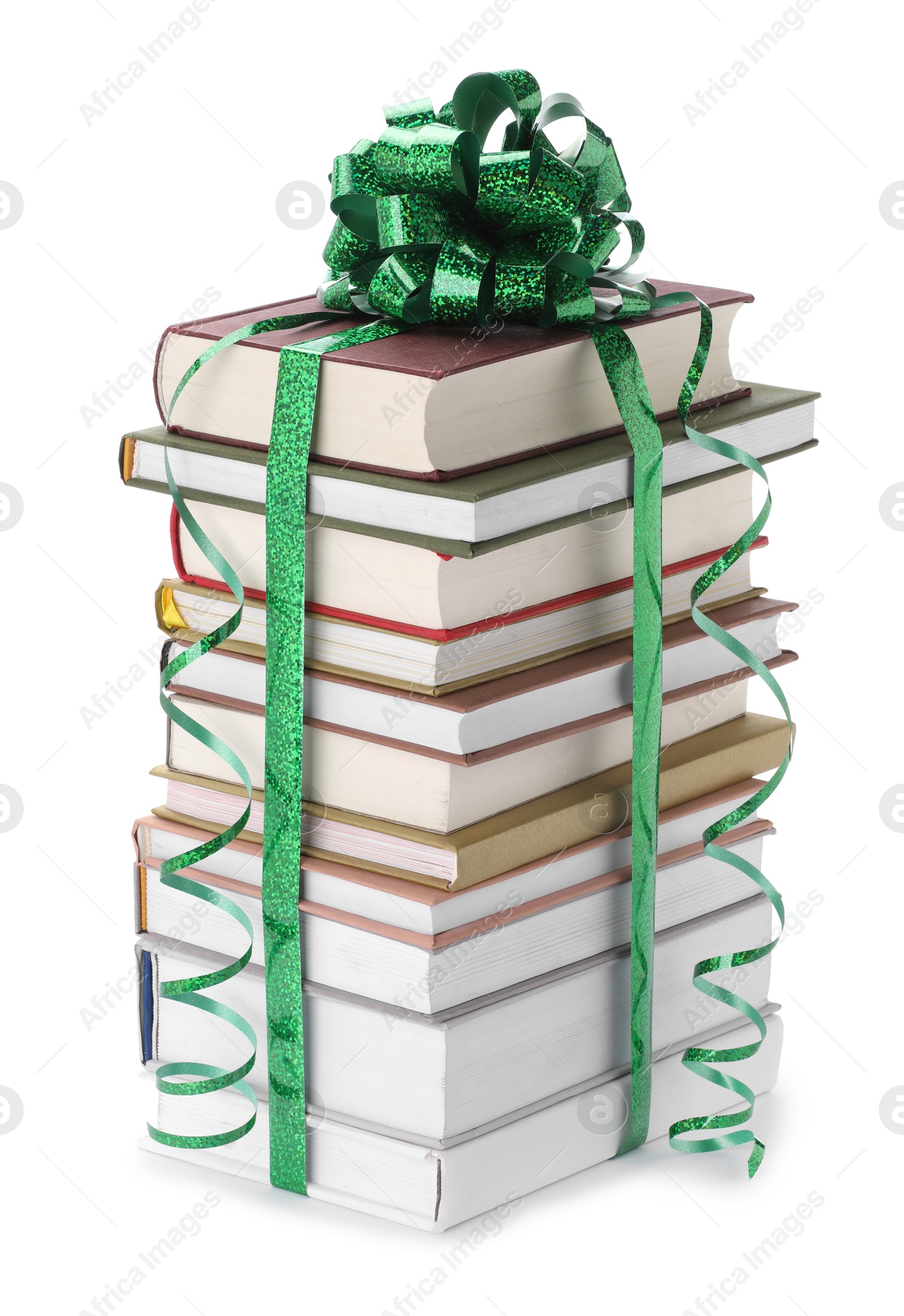 Photo of Stack of books with green bow as gift isolated on white