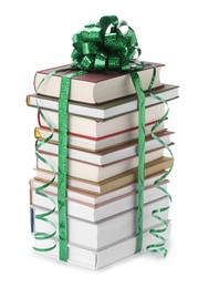 Photo of Stack of books with green bow as gift isolated on white