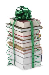 Photo of Stack of books with green bow as gift isolated on white