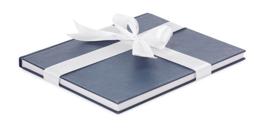 Photo of One book with silk ribbon as gift isolated on white