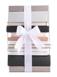 Photo of Stack of books with silk ribbon as gift isolated on white