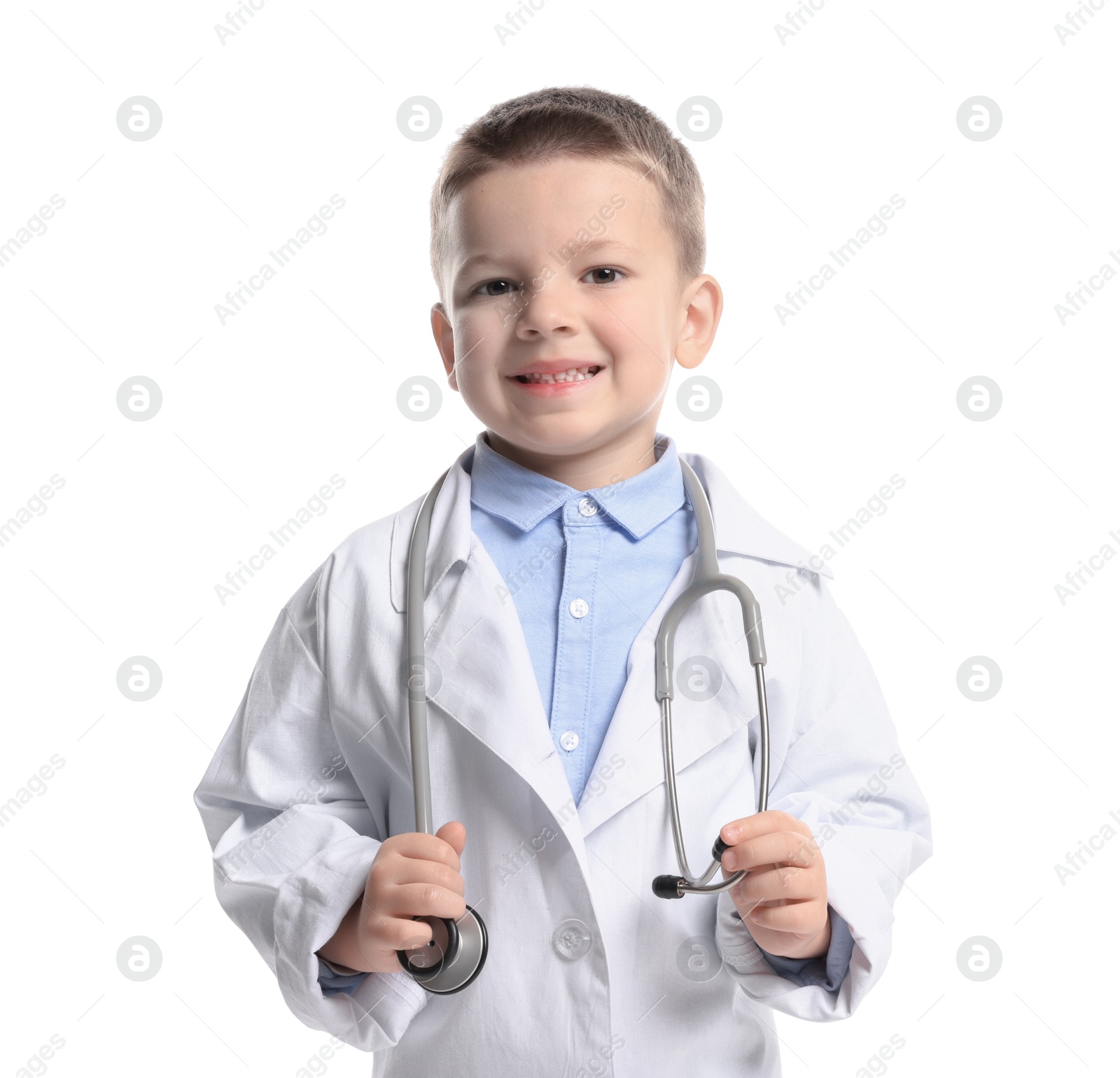 Photo of Little boy with stethoscope pretending to be doctor on white background. Dreaming of future profession