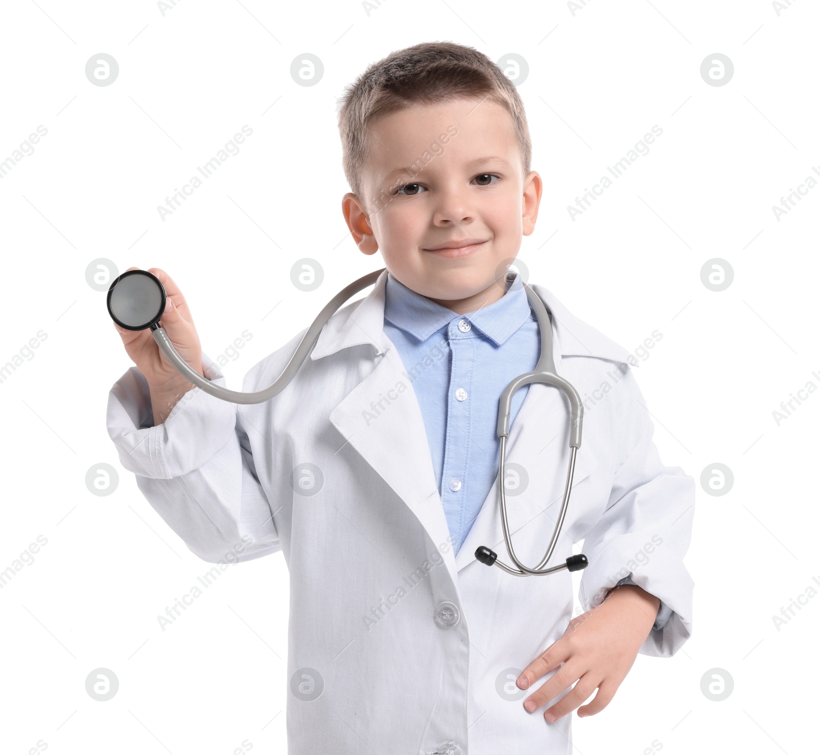 Photo of Little boy with stethoscope pretending to be doctor on white background. Dreaming of future profession